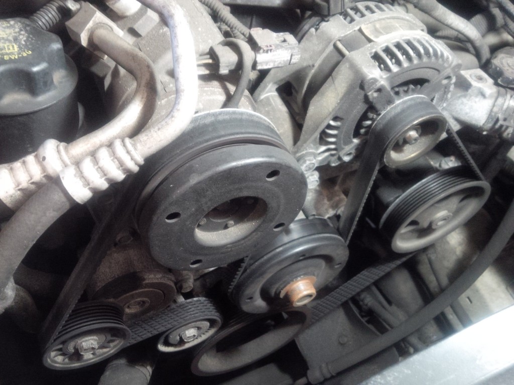 Correctly routed serpentine belt on an engine.