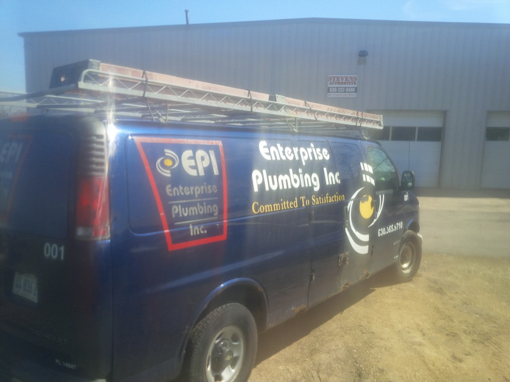 Enterprise Plumbing Inc. van parked outside Stevens Automotive.